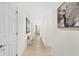 Bright hallway with tile flooring and neutral colors at 231 Riverside Dr # 1001, Holly Hill, FL 32117