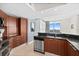 Kitchen with granite countertops and wood cabinets at 231 Riverside Dr # 1001, Holly Hill, FL 32117