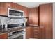 Kitchen detail, stainless steel appliances at 231 Riverside Dr # 1001, Holly Hill, FL 32117