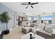 Open concept living room and kitchen with water views and modern decor at 231 Riverside Dr # 1001, Holly Hill, FL 32117