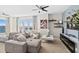 Spacious living room with comfortable sectional sofa and scenic waterfront views at 231 Riverside Dr # 1001, Holly Hill, FL 32117