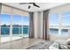 Living room with water views, sectional sofa, and access to balcony at 231 Riverside Dr # 1001, Holly Hill, FL 32117