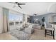Bright living room with comfortable seating and water views at 231 Riverside Dr # 1001, Holly Hill, FL 32117