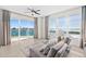 Living area with sectional sofa and sliding doors leading to a balcony with water views at 231 Riverside Dr # 1001, Holly Hill, FL 32117