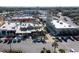 Aerial view of a shopping center with various stores and parking at 235 Pine Cone Trl, Ormond Beach, FL 32174