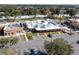 Aerial view of plaza shopping center with various stores and parking at 235 Pine Cone Trl, Ormond Beach, FL 32174