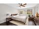Bedroom with dark hardwood floors and ceiling fan at 235 Pine Cone Trl, Ormond Beach, FL 32174