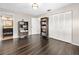 Bright bedroom with dark wood floors, built-in shelving, and a large closet at 235 Pine Cone Trl, Ormond Beach, FL 32174
