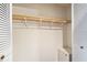 White closet with wood shelving and hanging rod at 235 Pine Cone Trl, Ormond Beach, FL 32174