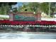 The Trails community entrance with festive holiday decor at 235 Pine Cone Trl, Ormond Beach, FL 32174