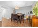 Bright dining room with tile floors and a modern light fixture at 235 Pine Cone Trl, Ormond Beach, FL 32174