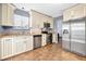 Kitchen features granite countertops and stainless steel appliances at 235 Pine Cone Trl, Ormond Beach, FL 32174