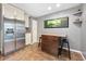Kitchen island with granite countertop and hardwood stools at 235 Pine Cone Trl, Ormond Beach, FL 32174