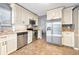 Kitchen features granite countertops and stainless steel appliances at 235 Pine Cone Trl, Ormond Beach, FL 32174