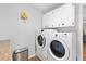 Laundry room features a washer, dryer and built in shelving at 235 Pine Cone Trl, Ormond Beach, FL 32174
