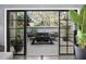Private patio with outdoor seating area, accessible from sliding doors at 235 Pine Cone Trl, Ormond Beach, FL 32174