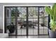 View of private patio accessible through sliding glass doors at 235 Pine Cone Trl, Ormond Beach, FL 32174