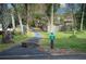 Paved walking trail winds through lush landscaping at 235 Pine Cone Trl, Ormond Beach, FL 32174