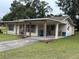 Ranch-style home with covered porch and a large yard at 284 Orange Camp Rd, Deland, FL 32724