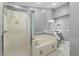 Clean bathroom with walk-in shower and a separate tub at 2888 Berkshire Woods Ter, Deltona, FL 32725