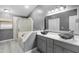 Elegant bathroom with dual sinks, marble countertops, and a soaking tub at 2888 Berkshire Woods Ter, Deltona, FL 32725