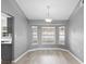 Bright dining area with bay window and wood-look floors at 2888 Berkshire Woods Ter, Deltona, FL 32725