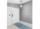 Bright entryway with light gray walls and a teal rug at 2888 Berkshire Woods Ter, Deltona, FL 32725