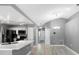 Modern kitchen featuring white cabinets, quartz countertops, and black appliances at 2888 Berkshire Woods Ter, Deltona, FL 32725