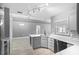 Modern kitchen with stainless steel appliances and white cabinets at 2888 Berkshire Woods Ter, Deltona, FL 32725