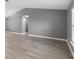 Spacious living area with light gray walls and wood-look floors at 2888 Berkshire Woods Ter, Deltona, FL 32725