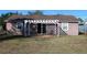 Private backyard with pergola and patio seating at 3019 N Covington Dr, Deltona, FL 32738
