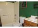 Clean bathroom with a tub, toilet, and sink at 3019 N Covington Dr, Deltona, FL 32738
