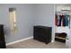 Bedroom with dresser, closet, and mirror at 3019 N Covington Dr, Deltona, FL 32738