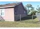 Side view of house, showing exterior and fence at 3019 N Covington Dr, Deltona, FL 32738