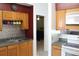 Kitchen with wood cabinets and tin backsplash at 3019 N Covington Dr, Deltona, FL 32738