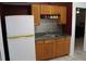 Kitchen with wood cabinets and a white refrigerator at 3019 N Covington Dr, Deltona, FL 32738