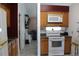 Kitchen with wood cabinets and white appliances at 3019 N Covington Dr, Deltona, FL 32738
