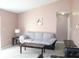 Bright living room with gray couch and tile floors at 3019 N Covington Dr, Deltona, FL 32738