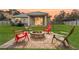 Cozy backyard with fire pit and seating area, perfect for entertaining at 304 Gardenia Ave, Debary, FL 32713
