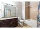 Clean bathroom with tub, shower, granite vanity, and updated fixtures at 304 Gardenia Ave, Debary, FL 32713