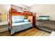 Bedroom with bunk bed and dresser at 304 Gardenia Ave, Debary, FL 32713