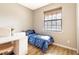 Small bedroom with twin bed, desk, and window at 304 Gardenia Ave, Debary, FL 32713