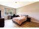 Spacious bedroom with large window and neutral decor at 304 Gardenia Ave, Debary, FL 32713