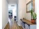 Light and airy hallway with light wood floors at 304 Gardenia Ave, Debary, FL 32713
