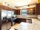 Modern kitchen with stainless steel appliances and granite countertops at 304 Gardenia Ave, Debary, FL 32713