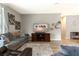Spacious living room with gray sectional sofa and flat-screen TV at 304 Gardenia Ave, Debary, FL 32713