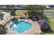 Aerial view of the community pool, playground, and basketball court offer many recreational options at 3125 Wood Rose Way, Deltona, FL 32725