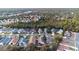 Aerial view of neighborhood with houses and trees at 3125 Wood Rose Way, Deltona, FL 32725