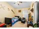 bedroom with a twin bed and plenty of toy storage at 3125 Wood Rose Way, Deltona, FL 32725