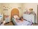 Cozy bedroom with a twin-sized bed and a dresser at 3125 Wood Rose Way, Deltona, FL 32725